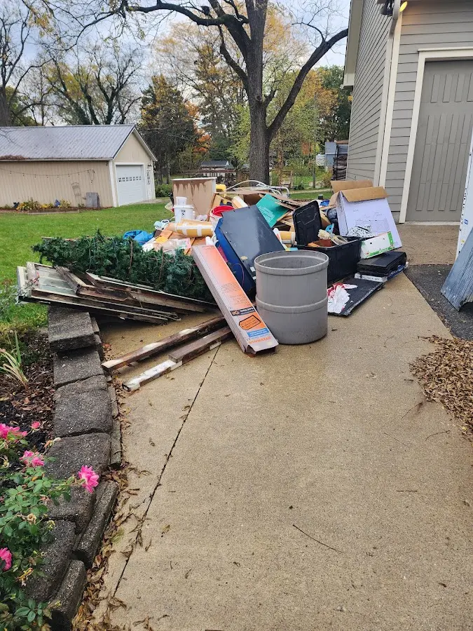 Dumpster being loaded with debris for 30 Yard Dumpster Rental in Kingston